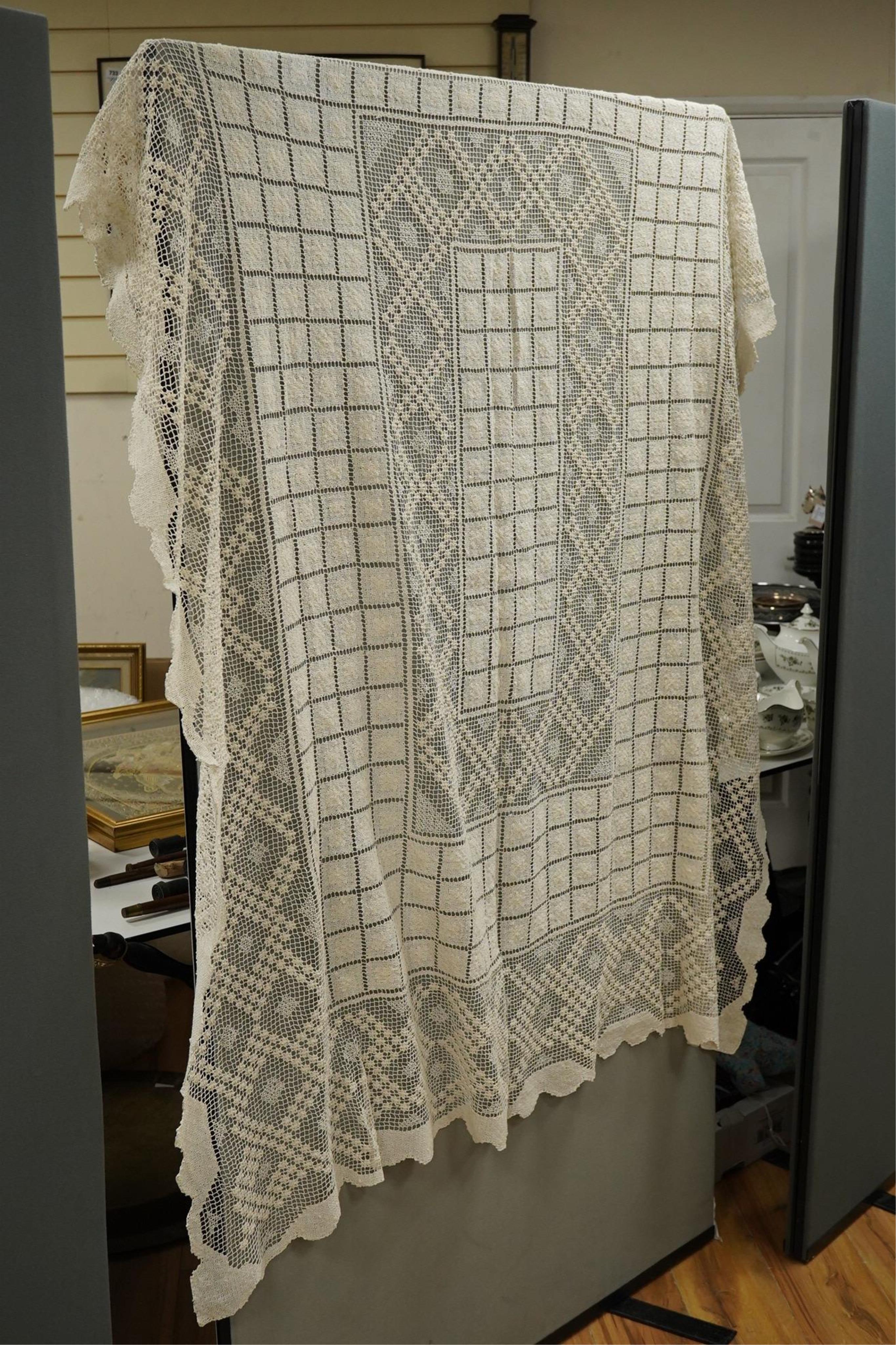 A collection of early 20th century and later crochet, cut work and drawn thread table linens and a large embroidered table cloth